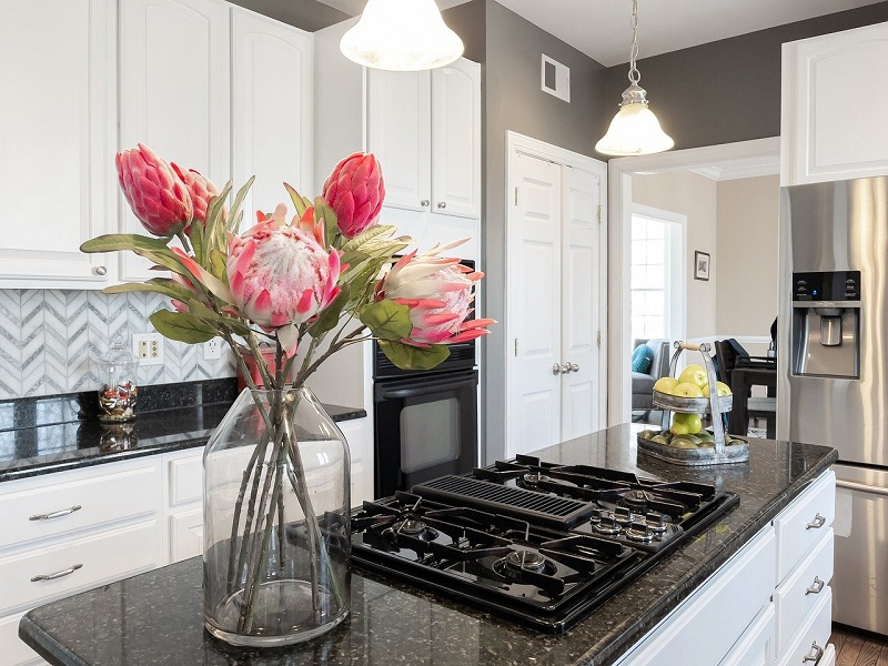 Flowers in a vase on a kitchen countertop