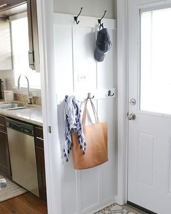 Extra hooks & board and batten in this tiny space right off the kitchen added a "secret" drop zone to a small house. (Read: No more bags + clutter in the kitchen ). Tackle this easy $40 project from DIY Playbook in a weekend!